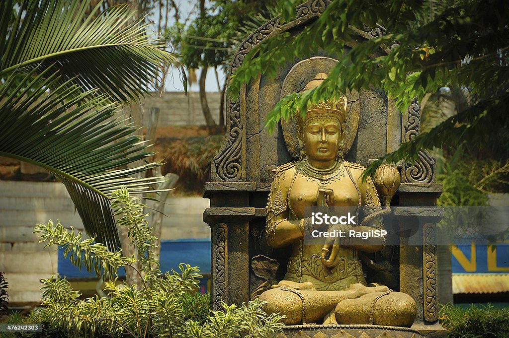 Gold female figure statue Taken at Ken Dedes Monument, Malang, east Java, Indonesia Ancient Stock Photo