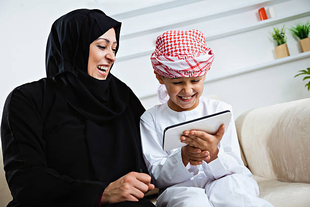 istock Happy Arabic child at home with his mother 476242325