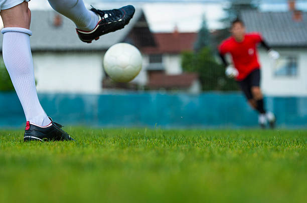 istock Soccer player performing free kick 476243031