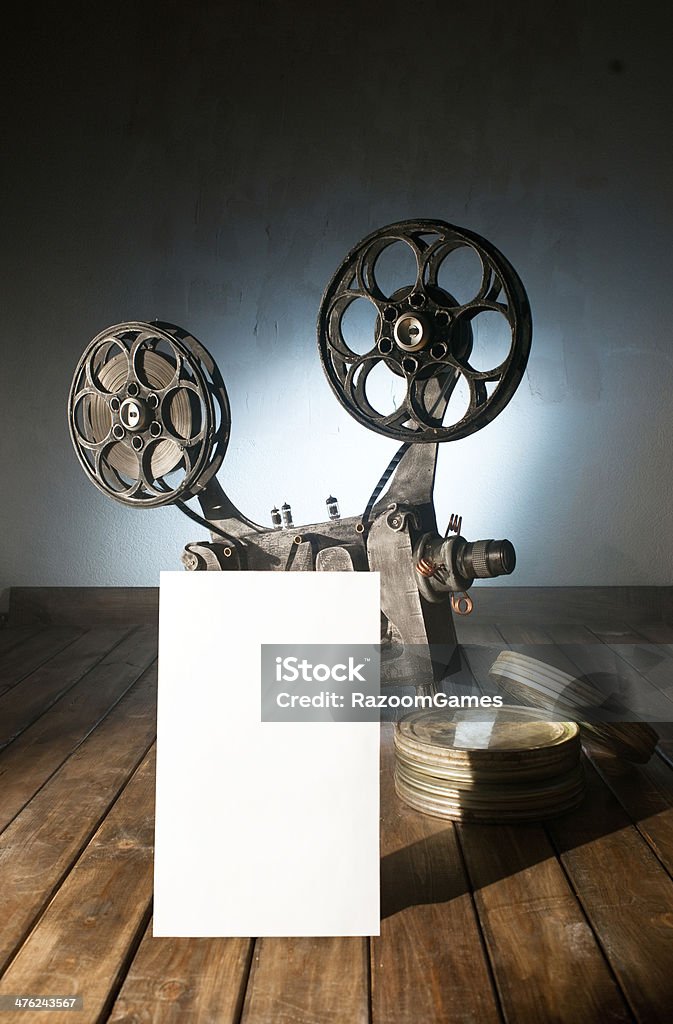 cinema Movie projector with the film on the wooden floor Art Stock Photo