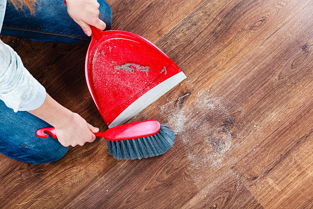 istock Cleaning woman sweeping wooden floor 476243938
