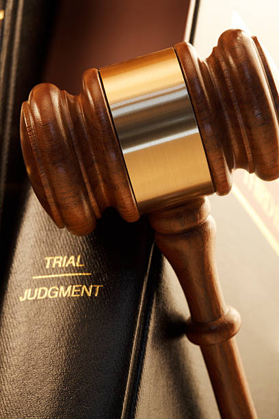 istock Gavel Leaning Against A Law Book 476245274