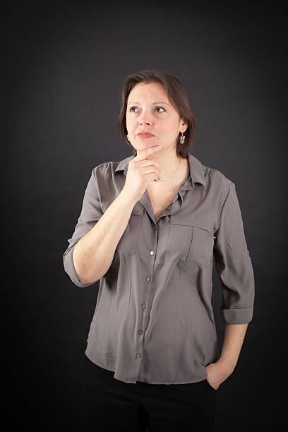 Beautiful woman doing different expressions in different sets of clothes: thinking