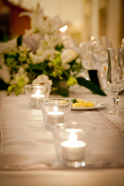 istock Candle and Glass on Bridal Table with Flowers 476248110