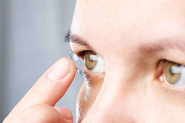 istock Woman puts contact lens 476249312