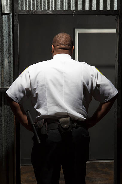 istock Rear View Of A Young Security Guard 476249385
