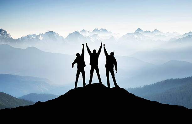 Sport team Team on mountain top. Active life concept group mountain silhouette stock pictures, royalty-free photos & images
