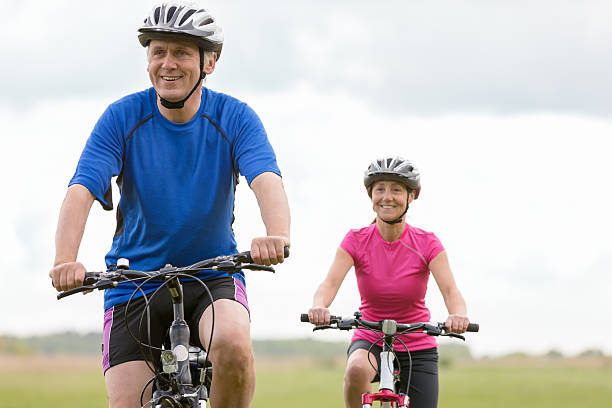 istock Mature couple outdoors riding bikes 476251154