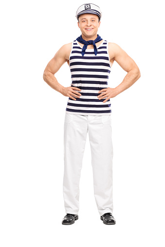 Full length portrait of a young man posing in sailor outfit smiling isolated on white background