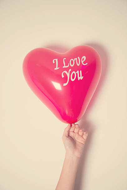 istock Hand holding balloon and text i love you 476256990