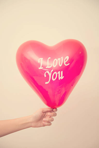 istock Hand holding balloon and text i love you 476257062