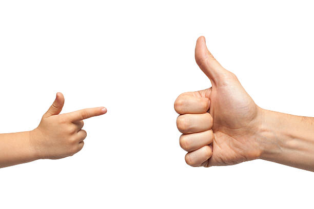 istock father and son giving like and pointing on white background 476257490