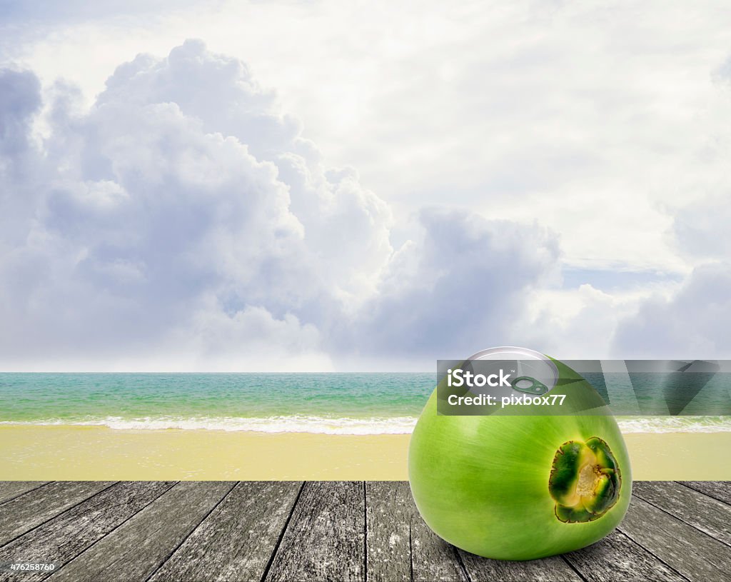 Fresh coconut with can open tool on top Fresh coconut with can open tool on top and sea background 2015 Stock Photo