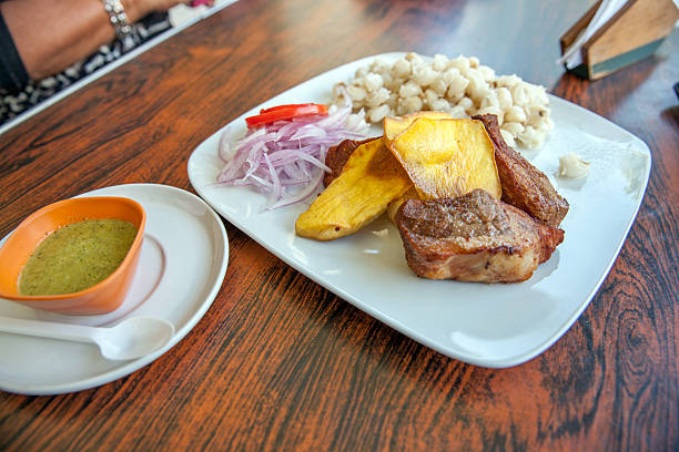 istock Peruvian chicharron with sweet potatoes and boiled corn 476259018