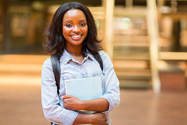 istock female african american university student with books 476262904