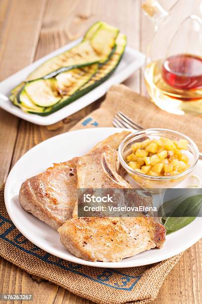 Pork Cutlets On A Bone With Apple Chutney Stock Photo - Download Image Now - Animal Bone, Apple - Fruit, Chutney