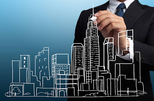 istock Business Man hand draw a cityscape 476264227
