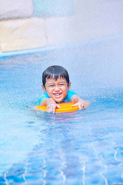 istock Boy learn to swim in pool 476265246