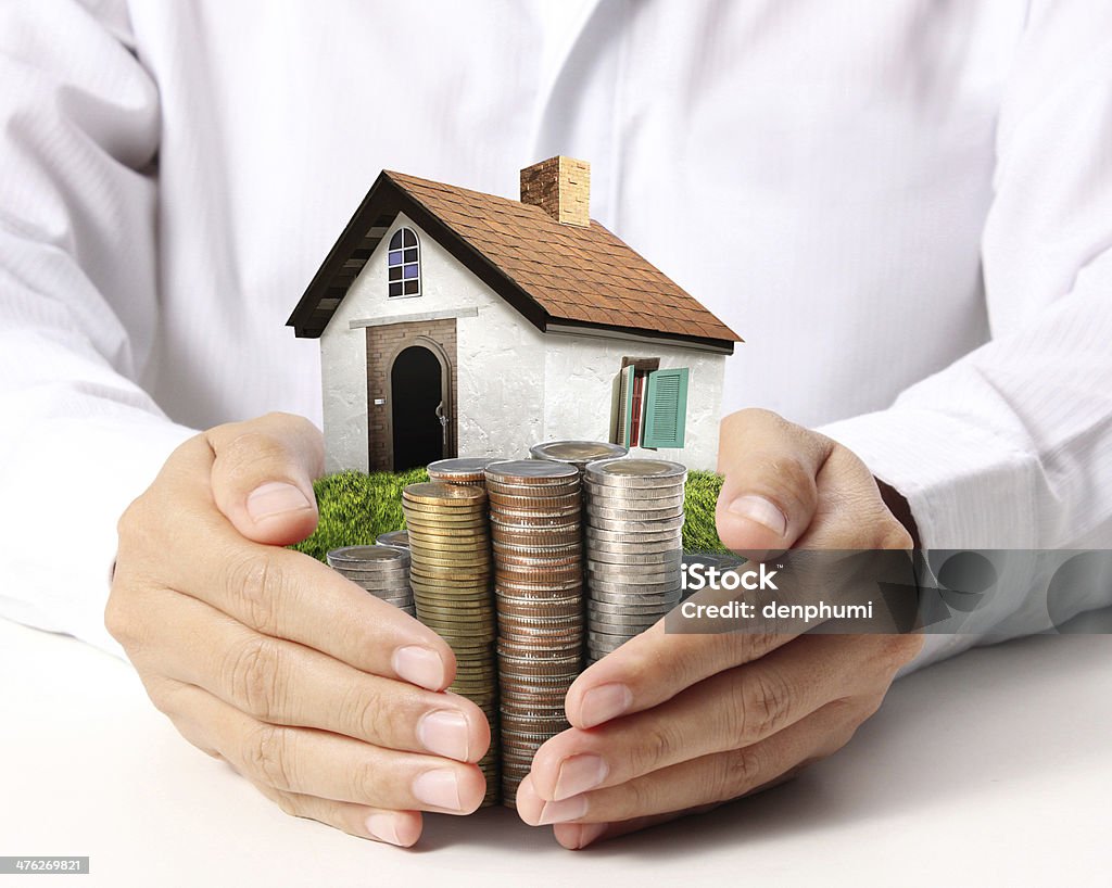 Protect Your House in hand businessmen Protect Your House in hand Adult Stock Photo