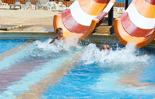 istock Children in summer outdoor pool. 476270961