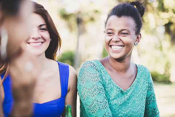 istock Three young women relaxing at the park 476271761
