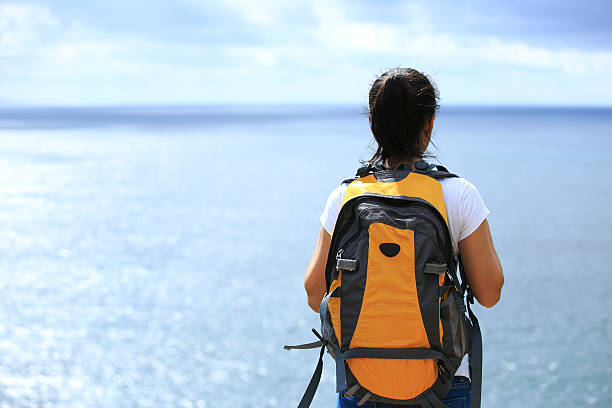 istock young woman hiker seaside 476271853