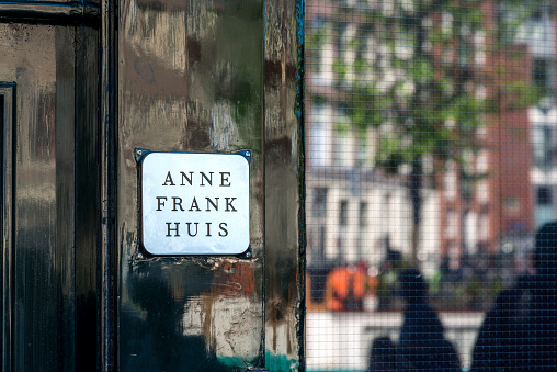 Amsterdam, the Netherlands - June 4, 2015: Nameplate on the house where Anne Frank lived during World War II. 
