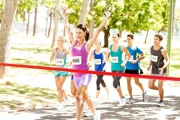 istock Excited Marathon Runner Crossing Finishing Line 476274028