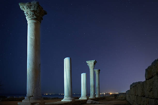 istock Ruins of ancient city columns under night sky 476274146