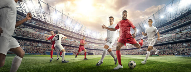 istock Soccer player kicking ball in stadium 476275448
