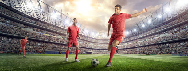 istock Soccer player kicking ball in stadium 476275454