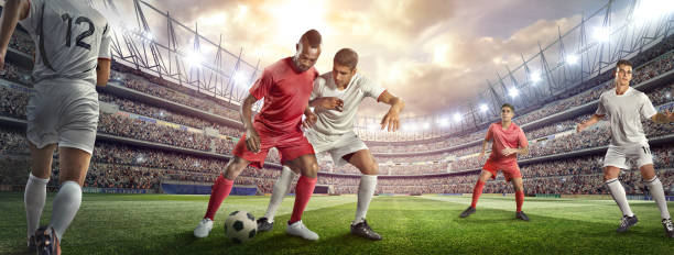 istock Soccer player tackling ball in stadium 476275456