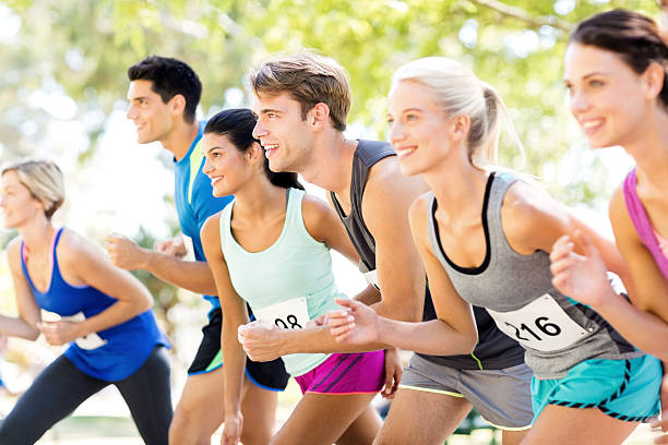 istock Group Of Multi-Ethnic Marathon Runners At Starting Line In Park 476278568