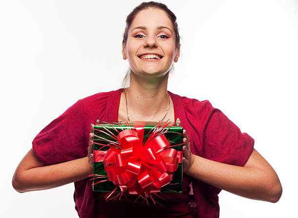 istock Young beautiful woman with present 476278700