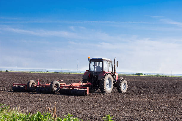 istock Red tractor in the field 476282356