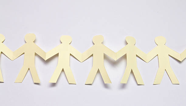 istock Cutout paper people over white background 476282599
