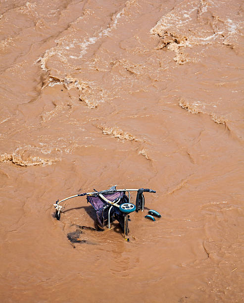 istock Pram, baby carriage in muddy water. 476283097