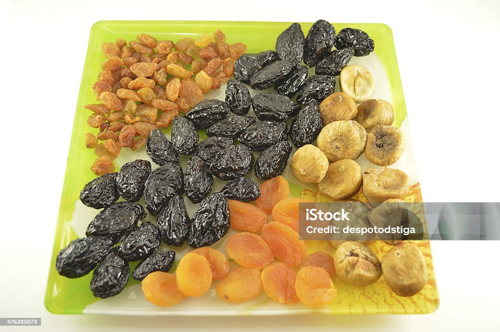 Dried fruits Various dried fruit in a bowl isolated on a white background. Apricot Stock Photo