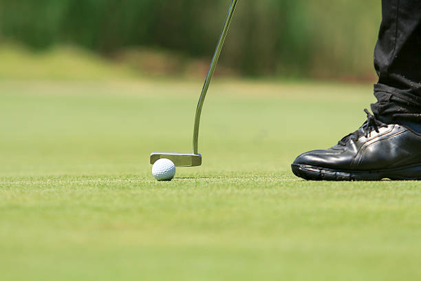 istock Golf player putting on the green 476286674