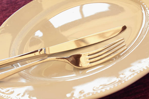istock plate, spoon and fork as a symbol of meals 476286750