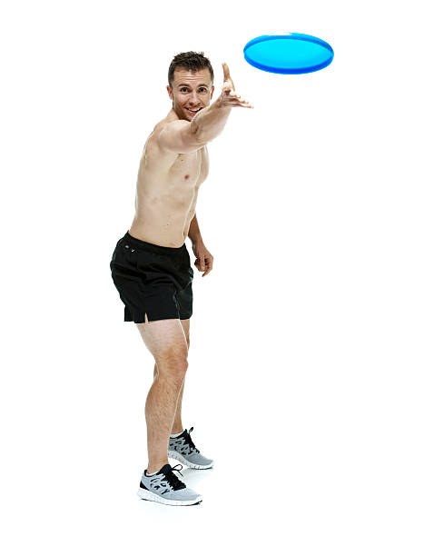 istock Muscular man throwing frisbee 476287360