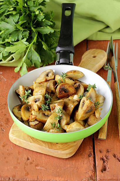 istock fried champignon mushrooms with thyme in a pan 476289459