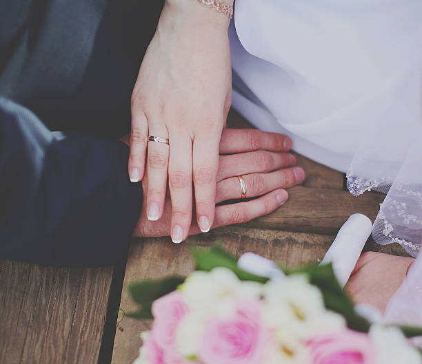 istock Bride and groom holding hands 476289739