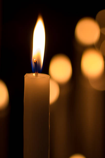istock burning candles  in the dark 476289980