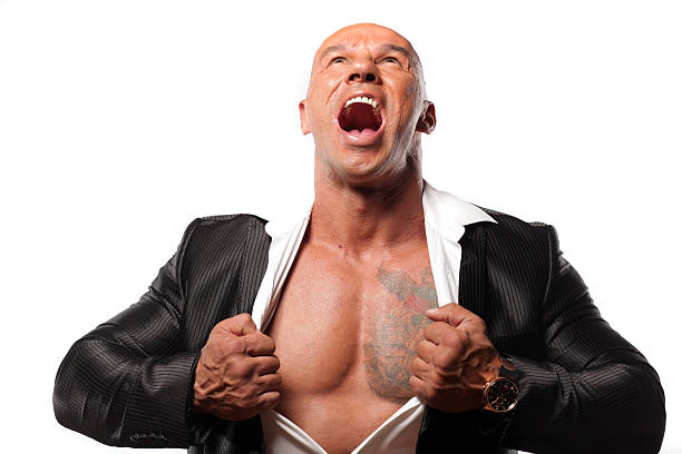 man screaming muscular bald man screaming and tearing his shirt chest tattoo men stock pictures, royalty-free photos & images