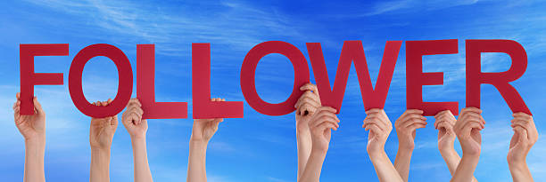 istock Hands Holding Red Straight Word Follower Blue Sky 476292176