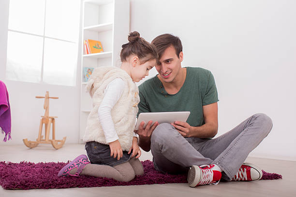 istock Father and daughter with a tablet 476293453