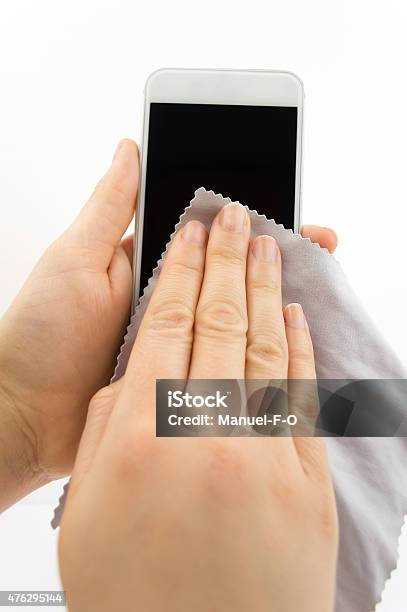 Cleaning My New Smartphone Stock Photo - Download Image Now - Cleaning, Smart Phone, Cleaner