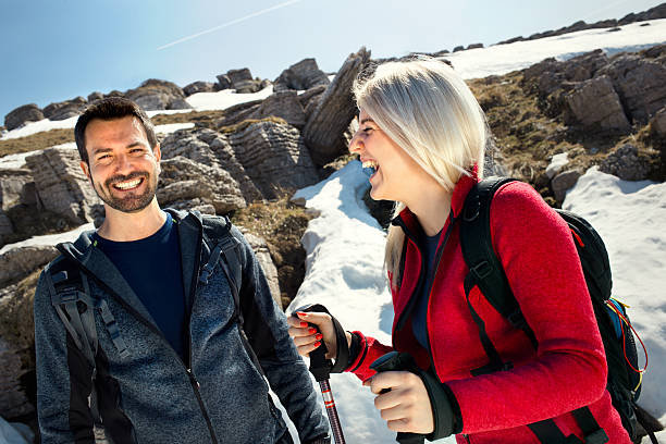 istock pair of hikers having fun in mountain 476295528