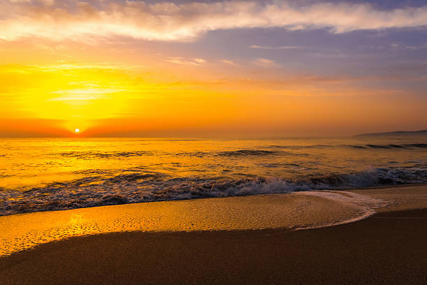istock Golden sunrise sunset over the sea ocean waves 476295996